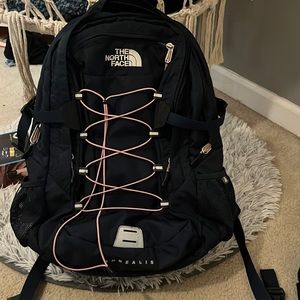 North face navy blue and pink tie book bag. Great for school:)